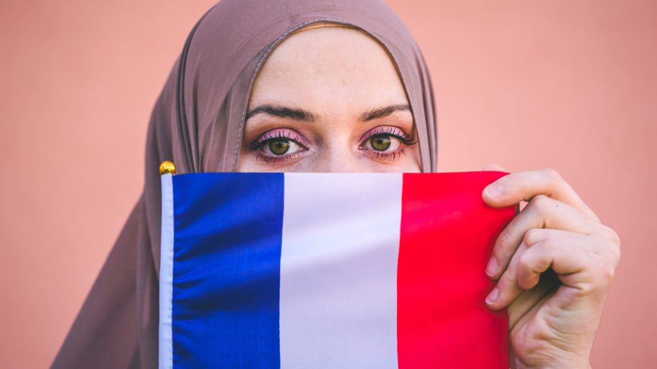 Muslim,Woman,In,Hijab,Holds,Flag,Of,France